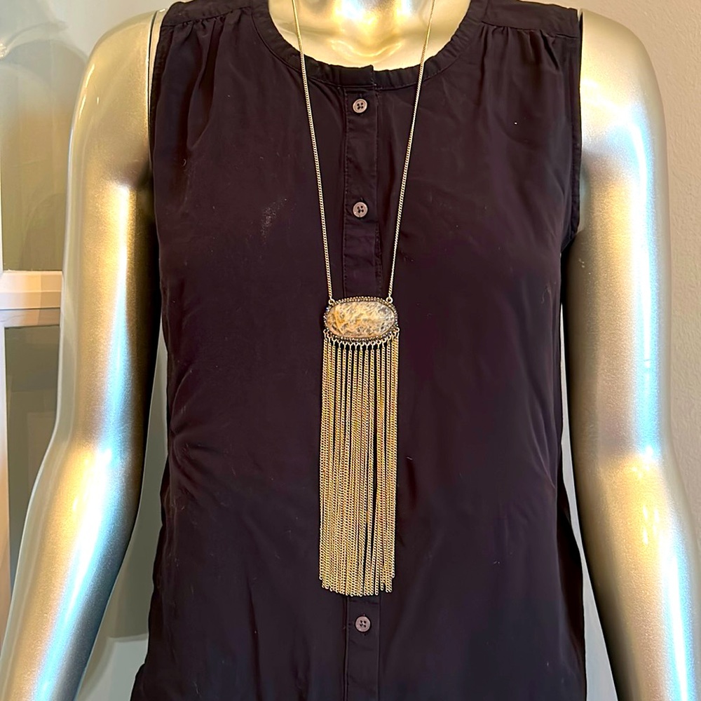 Gold necklace with long cream stone and chain pendant